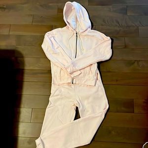Light pink Reebok track suit